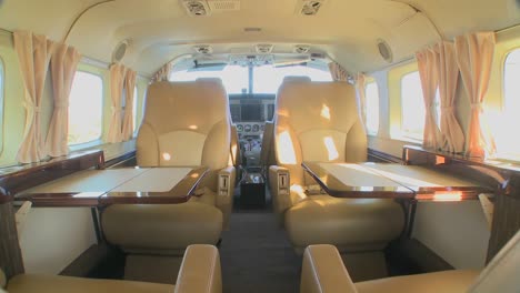 Dolly-forward-through-the-interior-of-a-corporate-luxury-jet