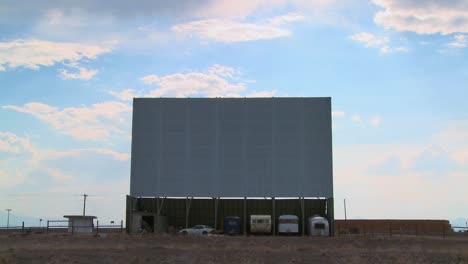 A-shot-of-clouds-passing-over-an-abandoned-drive-in-theater-screen