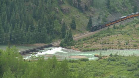 High-angle-of-a-steam-train-traveling-through-a-canyon