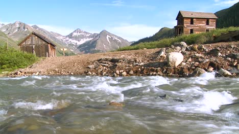 Colorado-ghost-town-with-river-flowing-foreground