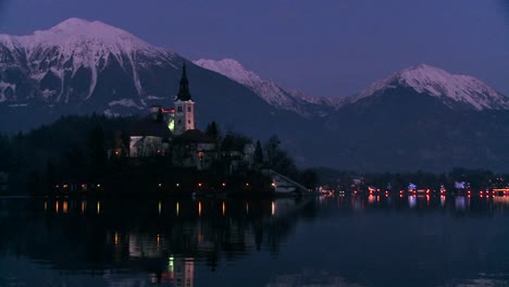 A-small-church-on-an-island-at-dawn-at-Lake-Bled-Slovenia-4