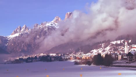 Time-lapse-of-a-distant-snowbound-village-in-the-Alps-in-Austria-Switzerland-Italy-Slovenia-or-an-Eastern-European-country