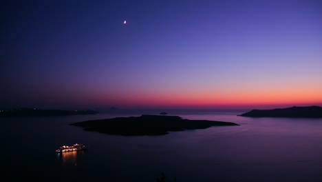 A-cruise-ship-moves-through-the-Greek-Isles-in-purple-light-at-dusk-2