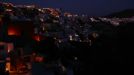 A-wide-shot-of-a-village-on-the-cliffs-of-Santorni-in-the-Greek-Islands-at-night-1