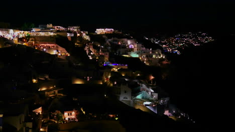 A-wide-shot-of-a-village-on-the-cliffs-of-Santorni-in-the-Greek-Islands-at-night-3
