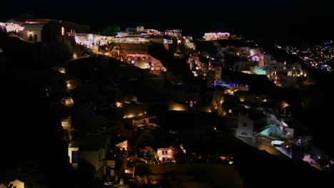 A-wide-shot-of-a-village-on-the-cliffs-of-Santorni-in-the-Greek-Islands-at-night-4