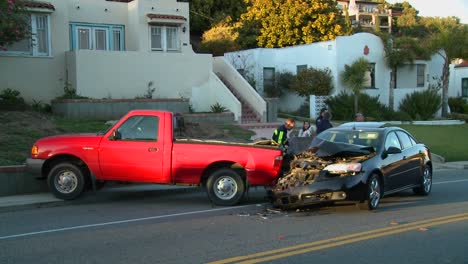 Onlookers-look-at-a-car-accident-on-a-city-street-1