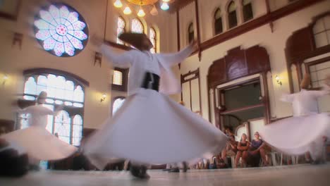 Stylish-slow-motion-shot-of-whirling-dervishes-perform-a-mystical-dance-in-Istanbul-Turkey