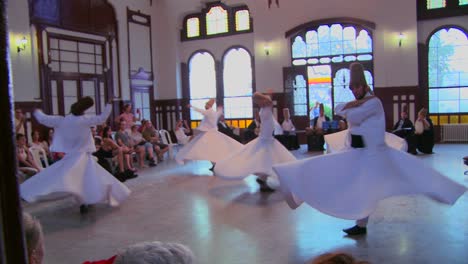 A-moving-shot-of-whirling-dervishes-perform-a-mystical-dance-in-Istanbul-Turkey