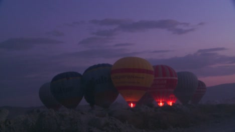 Hot-air-balloons-firing-up-at-dawn