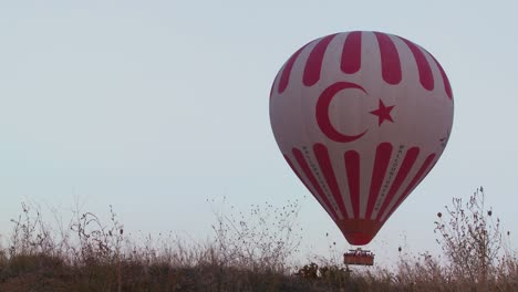 The-Turkish-flag-is-displayed-on-a-hot-air-balloon-in-Cappadocia-Turkey