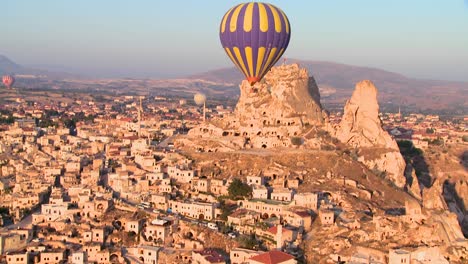 A-high-angle-of-hot-air-balloons-flying-over-the-ancient-region-of-Cappadocia-Turkey