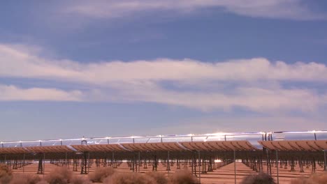Time-lapse-of-clouds-over-a-solar-generating-farm-in-the-desert