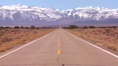 A-long-straight-lonely-road-heads-to-the-mountains