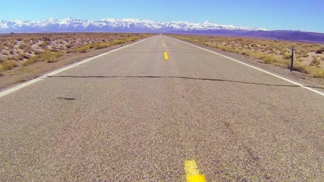POV-shot-along-a-desert-road-conduciendo-fast-1