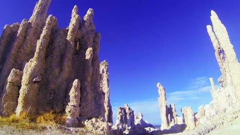 A-traveling-shot-beneath-the-tufa-spires-of-Mono-Lake-in-California-reveal-an-otherworldly-scene