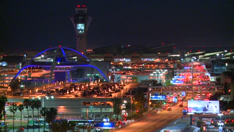 Thousands-of-travelers-arrive-at-Los-Angeles-International-airport-at-night-in-this-time-lapse-shot