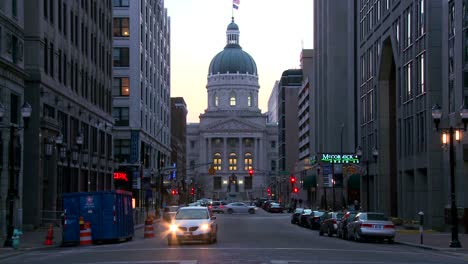 Traffic-passes-the-downtown-capital-building-in-Indianapolis-Indiana