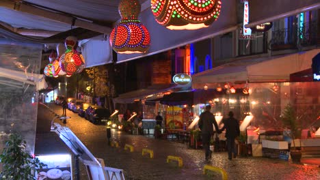 Rain-falls-at-night-outside-a-cafe-in-Istanbul-Turkey-1