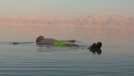 A-man-floats-on-his-back-in-the-Dead-Sea-of-Jordan-or-Israel