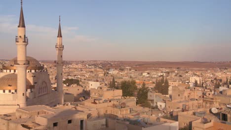 Pan-to-reveal-a-mosque-towering-above-the-Arab-city-of-Madaba-in-Jordan