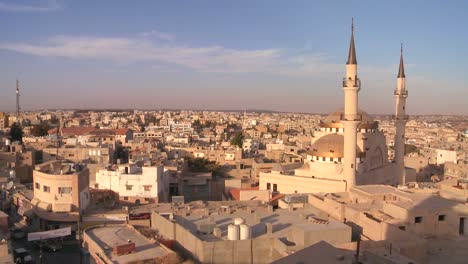 Beautiful-generic-wide-shot-of-a-mosque-towering-above-the-Arab-city-of-Madaba-in-Jordan