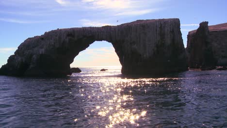 Sunlight-sparkles-on-the-sea-by-Anacapa-Islands-iconic-natural-bridge-in-Channel-Islands-National-Park