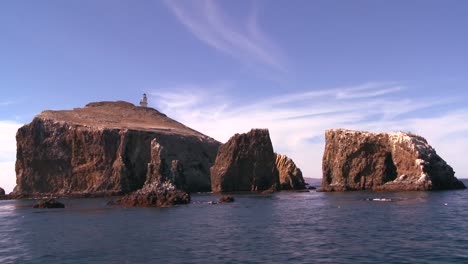 Anacapa-Island-its-lighthouse-and-surrounding-islets-in-Channel-Islands-National-Park-as-seen-from-a-boat-just-offshore