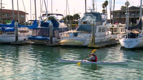 The-camera-tracks-a-kayaker-paddling-through-Santa-Barbara-Harbor