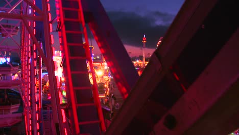 View-from-a-ferris-wheel-at-dusk-of-a-carnival-amusement-park-or-state-fair