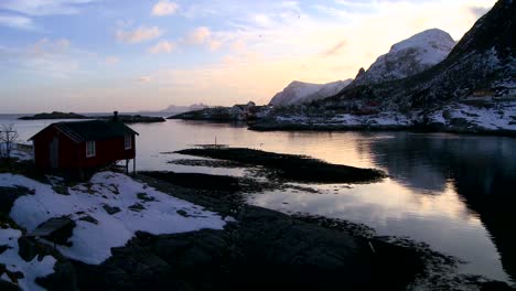 A-lonely-hut-sits-on-a-bay-in-the-Arctic-Lofoten-Islands-Norway-1