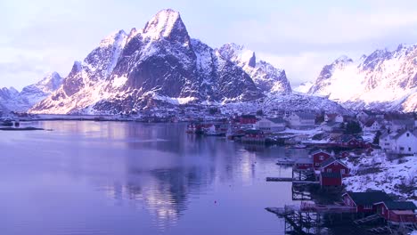 Snow-covers-a-beautiful-view-of-a-harbor-and-bay-in-a-village-in-the-Arctic-Lofoten-Islands-Norway
