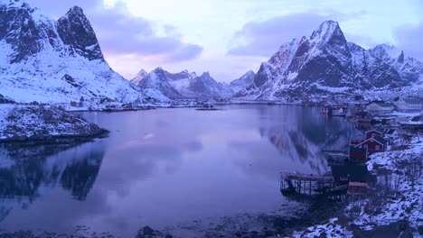 Snow-covers-a-spectacular-view-of-a-harbor-and-bay-in-a-village-in-the-Arctic-Lofoten-Islands-Norway