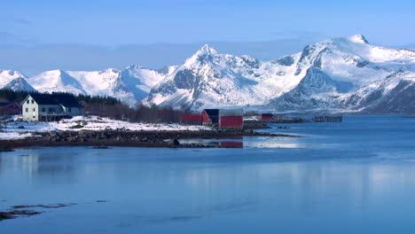 Snow-covered-peaks-and-lakes-decorate-a-remote-village-in-the-Arctic-Lofoten-Islands-Norway-1