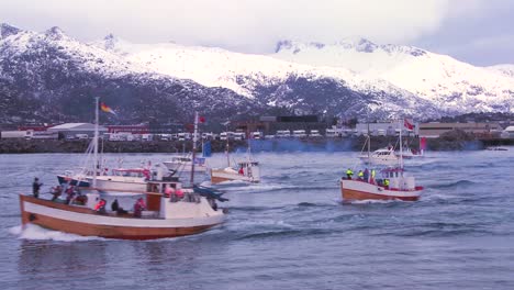 A-large-fleet-of-commercial-fishing-boats-sails-out-to-sea-of-Norway-in-the-Lofoten-Islands-1