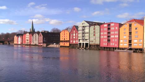 Colorful-wooden-buildings-line-the-waterfront-of-Trondheim-Norway-2