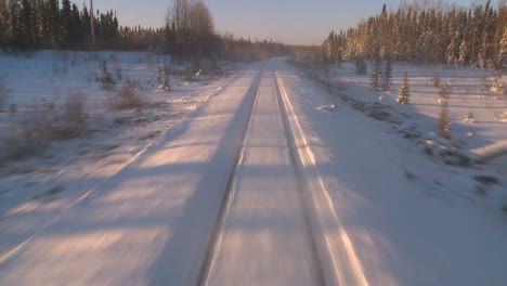POV-from-the-front-of-a-train-passing-through-a-snowy-landscape-6