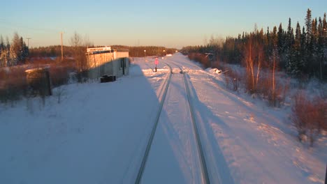 POV-from-the-front-of-a-train-passing-through-a-snowy-landscape-8