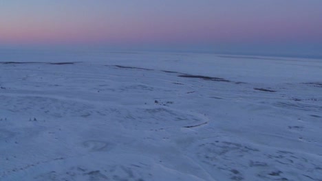 An-aerial-over-the-frozen-arctic-region-of-Hudson-bay-Canada-at-sunset-or-sunrise-1
