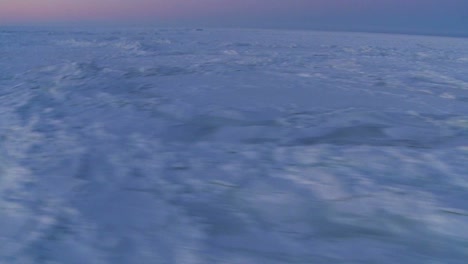 An-aerial-over-the-frozen-arctic-region-of-Hudson-bay-Canada-at-sunset-or-sunrise-4