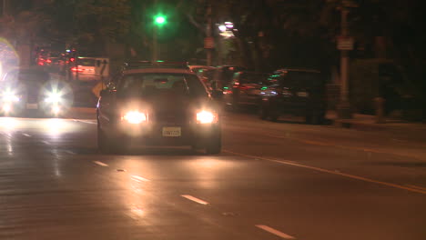 A-police-car-drives-on-a-downtown-Los-Angeles-street-at-night-1