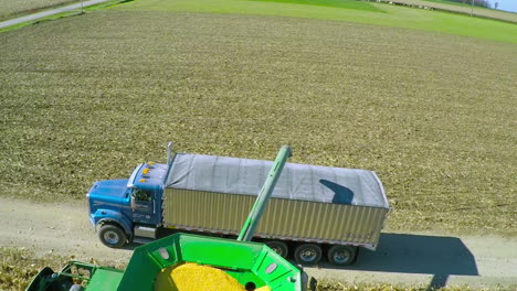 Excellent-aerial-over-a-rural-American-farm-with-corn-combine-harvester-at-work-2