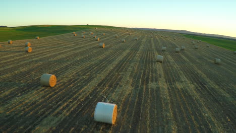An-aerial-over-bales-of-hay-in-a-farm-field-in-the-Midwest