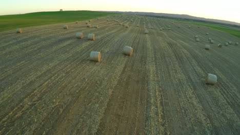 An-aerial-over-bales-of-hay-in-a-farm-field-in-the-Midwest-1