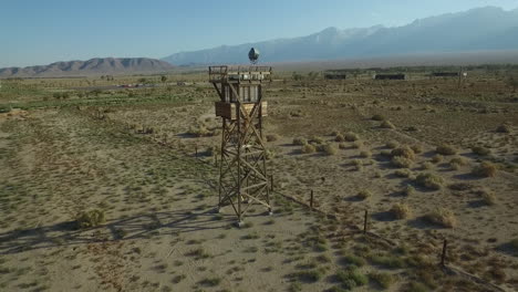 Stunning-aerial-over-the-Manzanar-Japanese-relocation-camp-ruins-in-the-Mojave-Desert-of-California-1