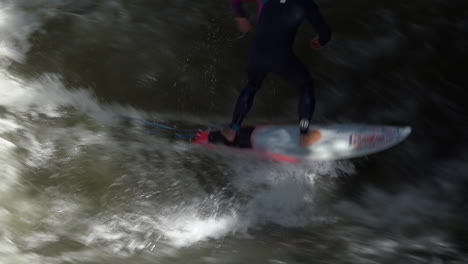 Surfers-brave-the-rapids-of-the-Eisbach-Río-in-Munich-Germany-in-slow-motion-2