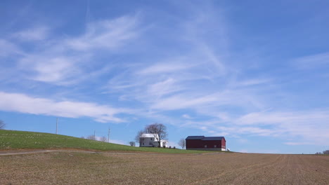 A-very-wide-shot-of-an-isolated-farm-in-the-Midwest-of-America