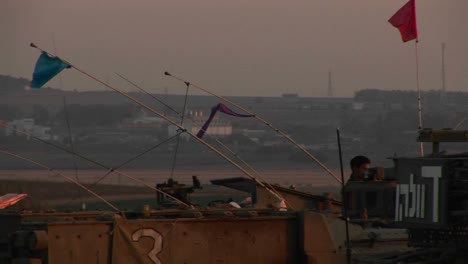 An-Israeli-tank-waits-at-the-border-of-Gaza-and-Israel