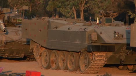 Israeli-armored-vehicles-sit-parked-in-the-desert
