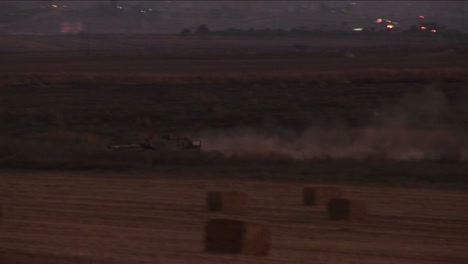 An-Israeli-tank-moves-through-a-no-man\'s-land-on-the-border-of-Israel-and-the-Gaza-Strip